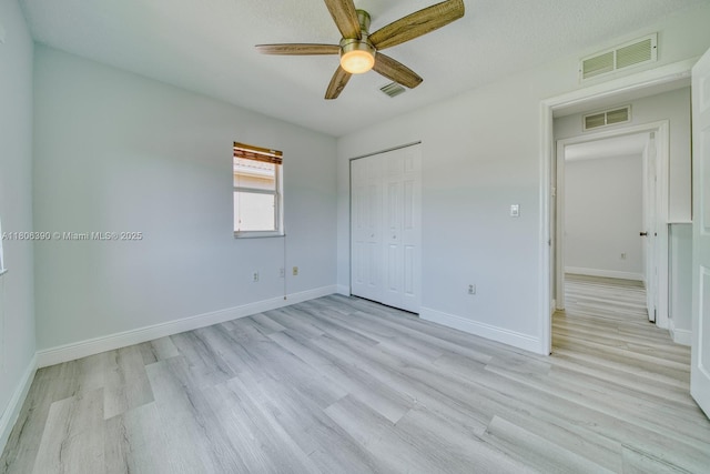 9018 SW 211th Ln, Cutler Bay, FL 33189 - unfurnished bedroom with light wood-style flooring, baseboards, a closet, and ceiling fan