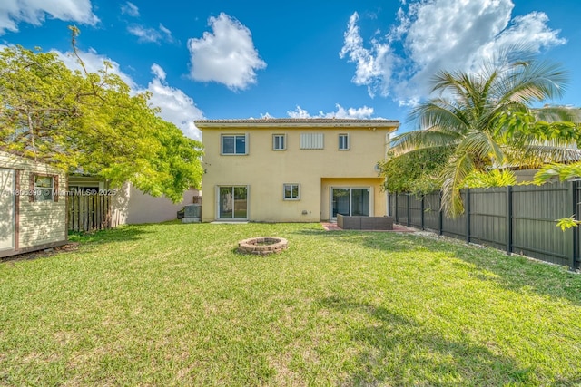 9018 SW 211th Ln, Cutler Bay, FL 33189 - back of property with a fire pit and stucco siding