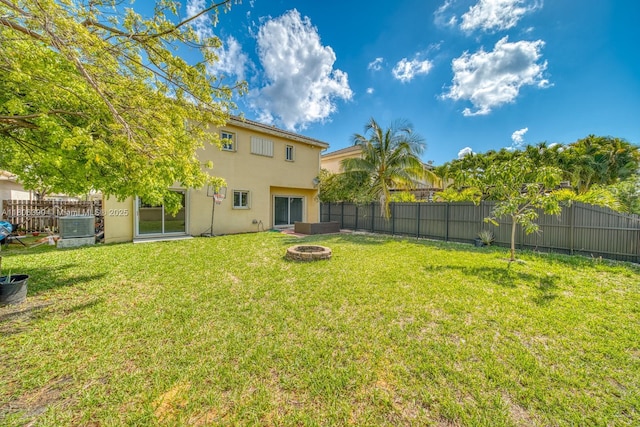 9018 SW 211th Ln, Cutler Bay, FL 33189 - view of yard with a fire pit and central air condition unit