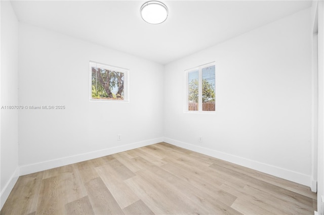 2608 NW 3rd St, Pompano Beach, FL 33069 - unfurnished room featuring baseboards and light wood-type flooring