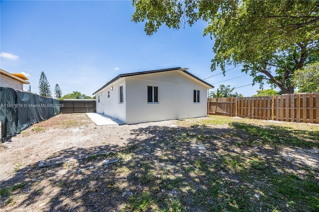 2608 NW 3rd St, Pompano Beach, FL 33069 - rear view of house featuring a fenced backyard