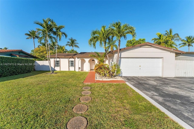 7230 SW 131st Ave, Miami, FL 33183 - ranch-style house with asphalt driveway, an attached garage, and stucco siding
