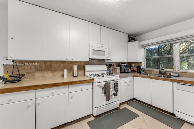 7230 SW 131st Ave, Miami, FL 33183 - kitchen featuring white appliances, a sink, decorative backsplash, and white cabinets