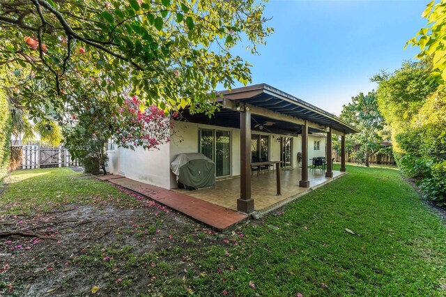 7230 SW 131st Ave, Miami, FL 33183 - rear view of house featuring a patio, a ceiling fan, and stucco siding
