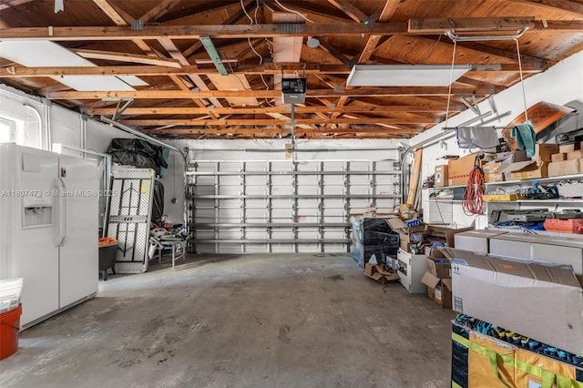 7230 SW 131st Ave, Miami, FL 33183 - garage featuring a garage door opener and white refrigerator with ice dispenser