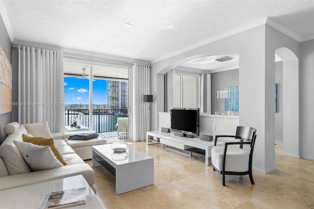 17100 N Bay Rd Unit 1608, Sunny Isles Beach, FL 33160 - living area featuring arched walkways, a textured ceiling, and crown molding