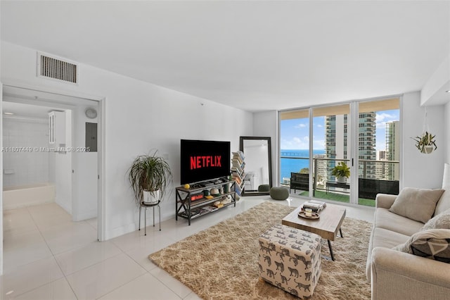 1155 Brickell Bay Dr Unit 2005, Miami, FL 33131 - tiled living room with a wall of windows and baseboards
