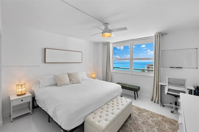 1155 Brickell Bay Dr Unit 2005, Miami, FL 33131 - tiled bedroom featuring a water view, a ceiling fan, and baseboards