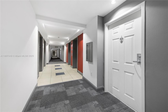 1155 Brickell Bay Dr Unit 2005, Miami, FL 33131 - hallway featuring light colored carpet, baseboards, and light tile patterned floors