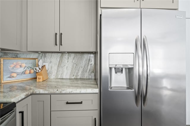 1437 NW 154th Ln, Pembroke Pines, FL 33028 - kitchen with appliances with stainless steel finishes, gray cabinets, decorative backsplash, and light stone countertops