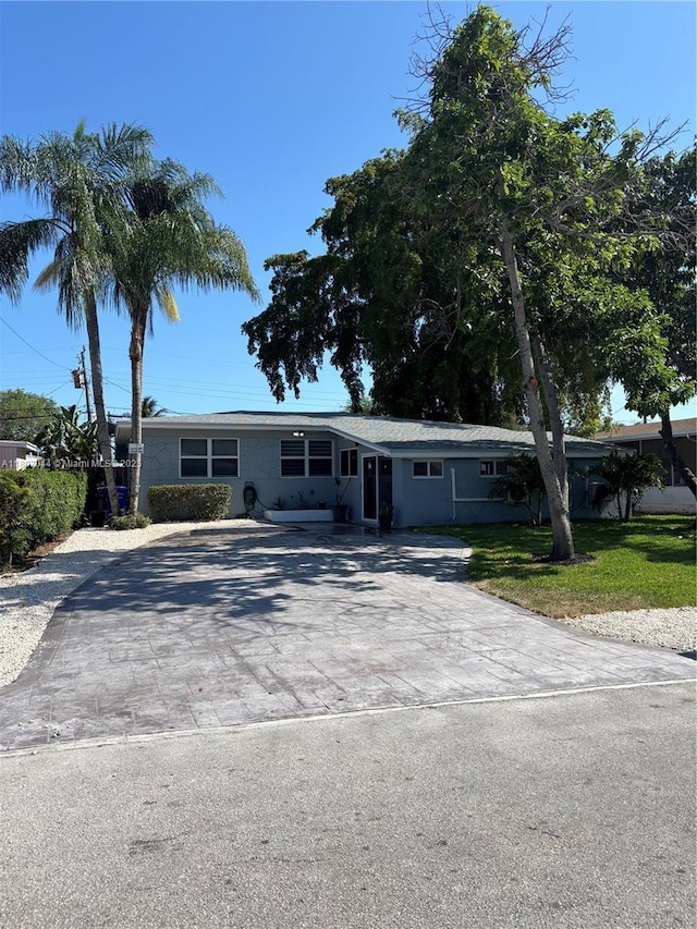 6516 Flagler St, Hollywood, FL 33023 - single story home with driveway and a front lawn