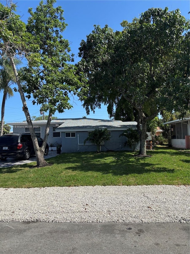 6516 Flagler St, Hollywood, FL 33023 - view of front of house featuring a front yard