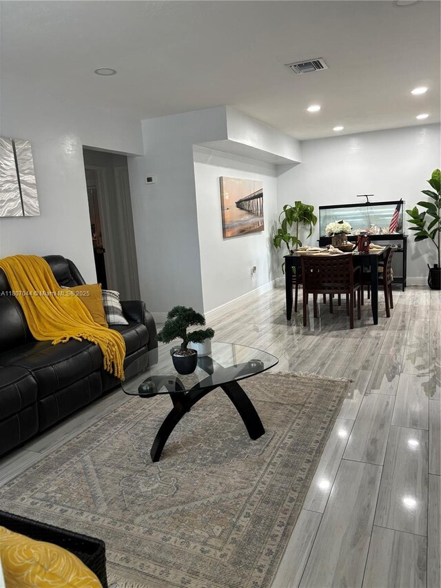 6516 Flagler St, Hollywood, FL 33023 - living area featuring baseboards, wood finished floors, and recessed lighting