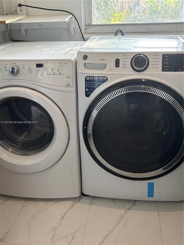 6516 Flagler St, Hollywood, FL 33023 - laundry area with washing machine and clothes dryer and marble finish flooring