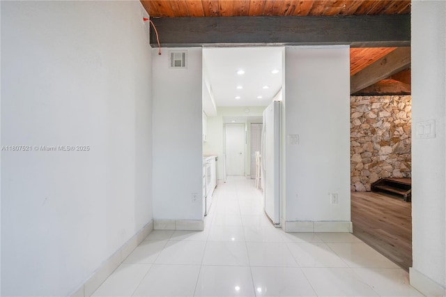 19412 NE 26th Ave Unit 143B, Miami, FL 33180 - hallway featuring light tile patterned flooring and baseboards