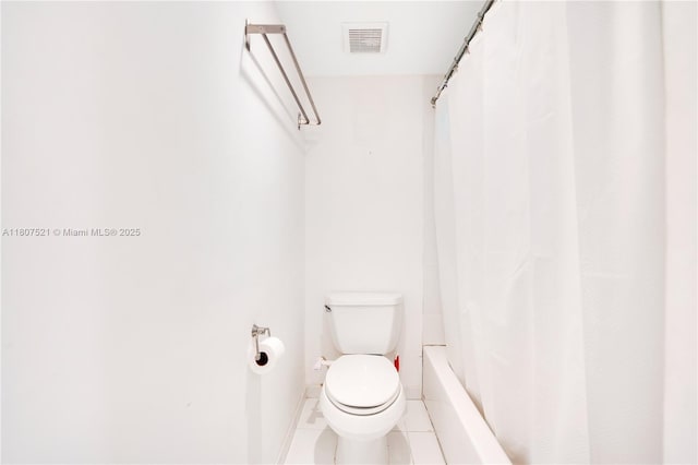 19412 NE 26th Ave Unit 143B, Miami, FL 33180 - bathroom featuring toilet, baseboards, and tile patterned floors