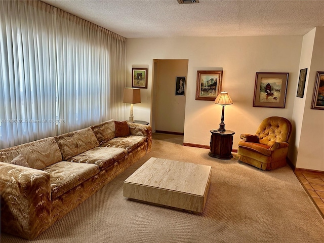 2040 N Hibiscus Dr, North Miami, FL 33181 - carpeted living room with baseboards and a textured ceiling