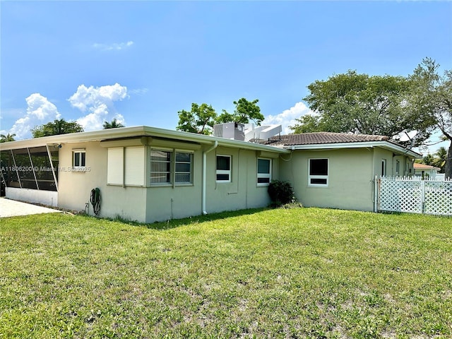 2040 N Hibiscus Dr, North Miami, FL 33181 - back of property with a sunroom and stucco siding
