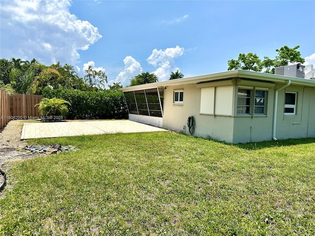 2040 N Hibiscus Dr, North Miami, FL 33181 - view of yard with a sunroom and a patio area