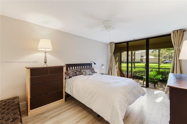 133 NW 98th Ter, Plantation, FL 33324 - bedroom with access to exterior, wood finished floors, and a ceiling fan