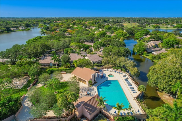 133 NW 98th Ter, Plantation, FL 33324 - drone / aerial view of a pool, a large body of water, and a tree filled landscape