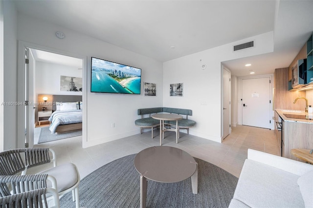 601 NE 1st Ave Unit 3507, Miami, FL 33132 - living room featuring light tile patterned flooring and baseboards