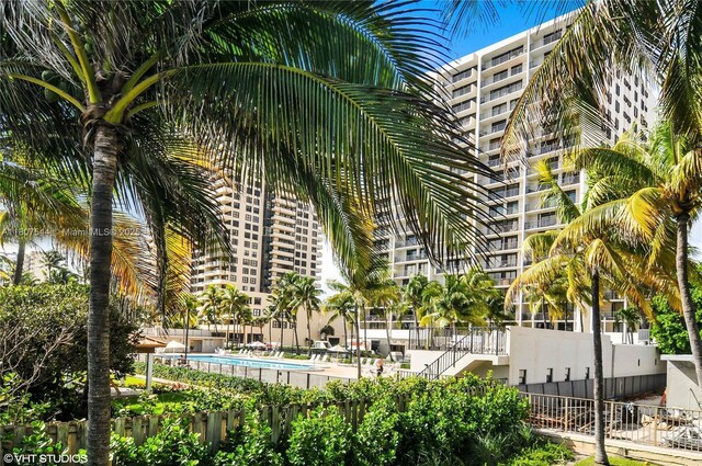 2625 Collins Ave Unit 1408, Miami Beach, FL 33140 - view of building exterior with a community pool