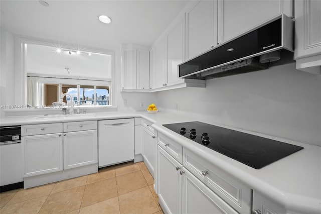 5235 Fisher Island Dr Unit 5235, Miami Beach, FL 33109 - kitchen with dishwasher, black electric stovetop, a sink, under cabinet range hood, and white cabinetry