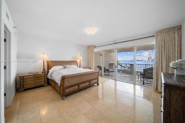 5235 Fisher Island Dr Unit 5235, Miami Beach, FL 33109 - bedroom with access to exterior, a water view, and light tile patterned floors