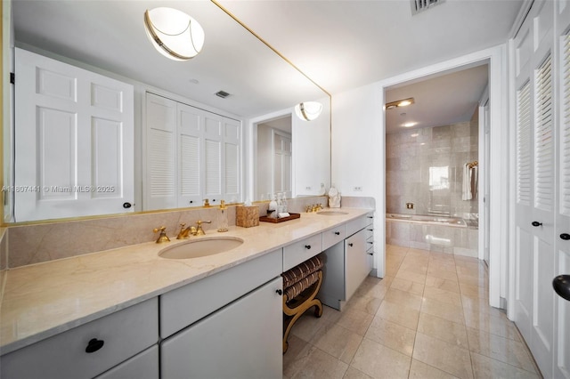 5235 Fisher Island Dr Unit 5235, Miami Beach, FL 33109 - full bathroom featuring a closet, double vanity, tiled bath, and tile patterned floors