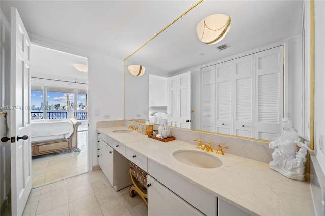 5235 Fisher Island Dr Unit 5235, Miami Beach, FL 33109 - bathroom with ensuite bath, tile patterned flooring, and double vanity