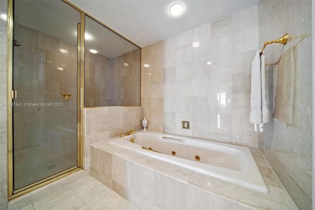 5235 Fisher Island Dr Unit 5235, Miami Beach, FL 33109 - full bath featuring tile walls, a stall shower, a jetted tub, and tile patterned floors