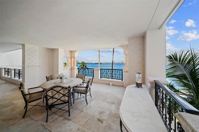 5235 Fisher Island Dr Unit 5235, Miami Beach, FL 33109 - dining space with a water view, plenty of natural light, and decorative columns