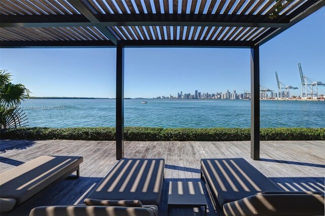 5235 Fisher Island Dr Unit 5235, Miami Beach, FL 33109 - view of patio featuring a pergola and a deck with water view