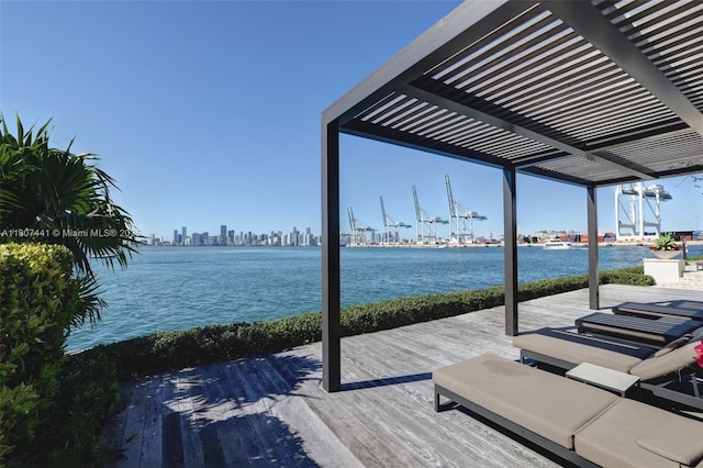 5235 Fisher Island Dr Unit 5235, Miami Beach, FL 33109 - wooden terrace featuring a water view, a pergola, and a view of skyline