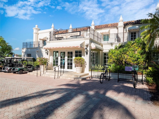 5235 Fisher Island Dr Unit 5235, Miami Beach, FL 33109 - back of property featuring french doors, a balcony, and stucco siding