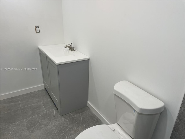 2041 NW 81st Ave Unit 414, Pembroke Pines, FL 33024 - bathroom featuring toilet, baseboards, vanity, and tile patterned floors