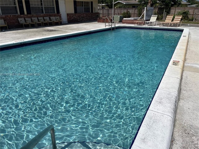 2041 NW 81st Ave Unit 414, Pembroke Pines, FL 33024 - community pool featuring a patio area
