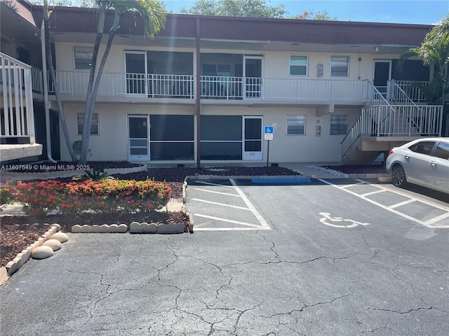 2041 NW 81st Ave Unit 414, Pembroke Pines, FL 33024 - view of building exterior with uncovered parking and stairs