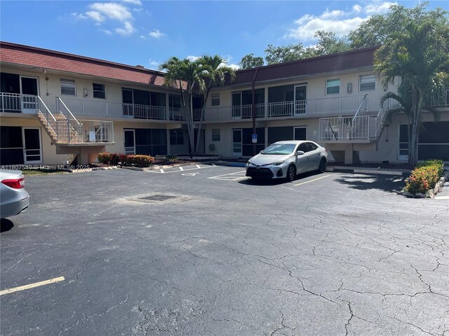 2041 NW 81st Ave Unit 414, Pembroke Pines, FL 33024 - view of property with uncovered parking