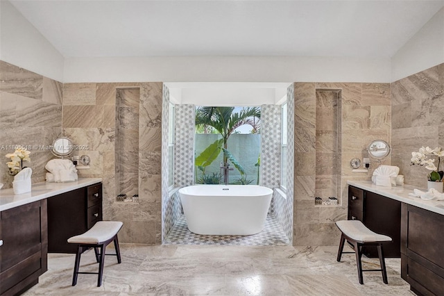16301 SW 62nd St, Southwest Ranches, FL 33331 - bathroom featuring tile walls, a freestanding bath, vanity, and marble tiled floors