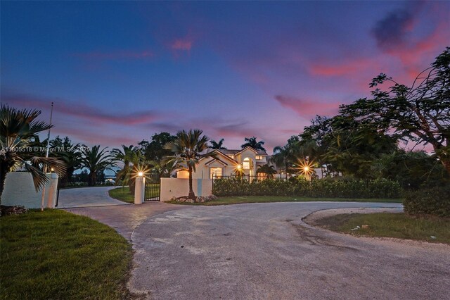 16301 SW 62nd St, Southwest Ranches, FL 33331 - view of front of property featuring curved driveway, a gate, and a fenced front yard