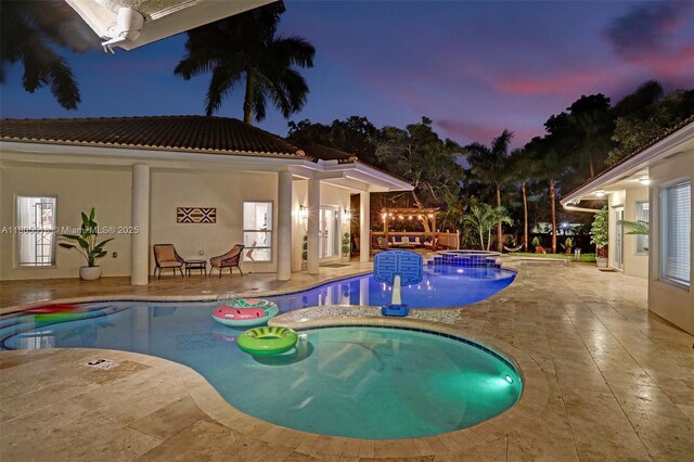 16301 SW 62nd St, Southwest Ranches, FL 33331 - view of swimming pool featuring a patio and a pool with connected hot tub