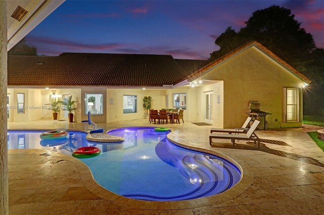 16301 SW 62nd St, Southwest Ranches, FL 33331 - view of pool with a patio area, outdoor dining area, and a pool with connected hot tub