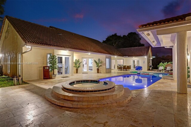 16301 SW 62nd St, Southwest Ranches, FL 33331 - view of swimming pool featuring french doors, a pool with connected hot tub, and a patio area