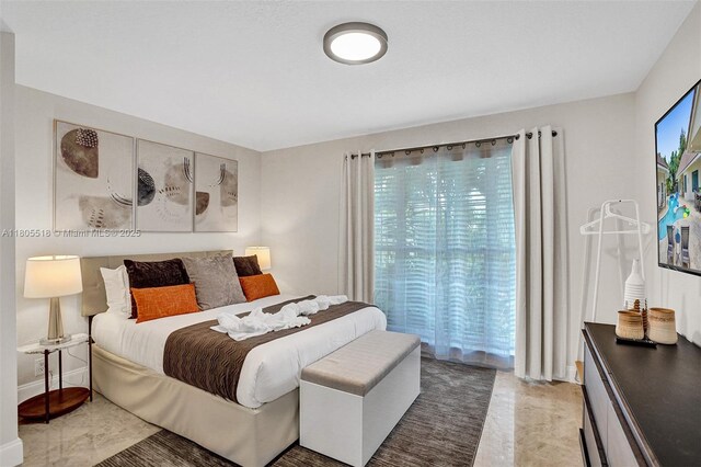 16301 SW 62nd St, Southwest Ranches, FL 33331 - bedroom with light marble finish flooring and multiple windows