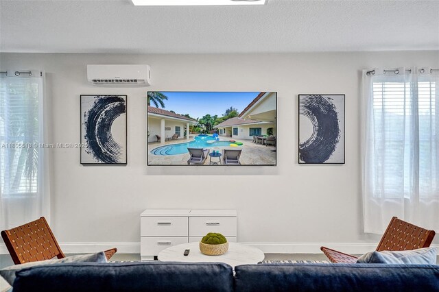 16301 SW 62nd St, Southwest Ranches, FL 33331 - living room featuring a wall mounted AC and baseboards