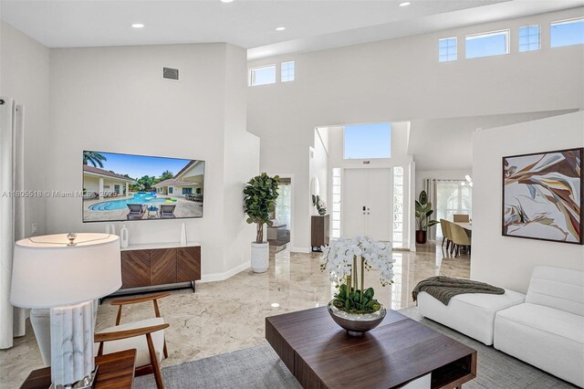 16301 SW 62nd St, Southwest Ranches, FL 33331 - living room featuring a towering ceiling, marble tiled flooring, recessed lighting, and baseboards