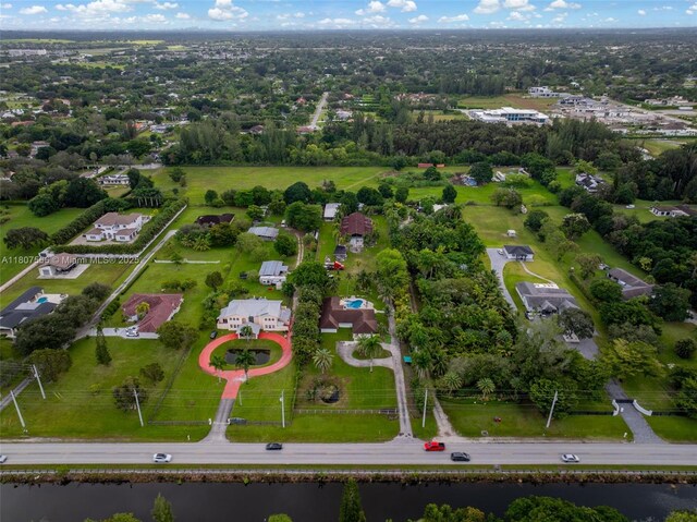 5310 SW 172nd Ave, Southwest Ranches, FL 33331 - aerial overview of property's location with a nearby body of water and a tree filled landscape