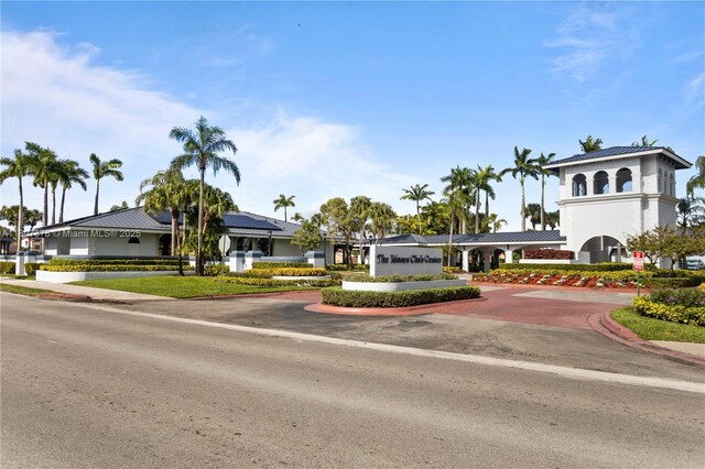 17320 NW 66th Pl, Hialeah, FL 33015 - view of front of property featuring curved driveway and metal roof